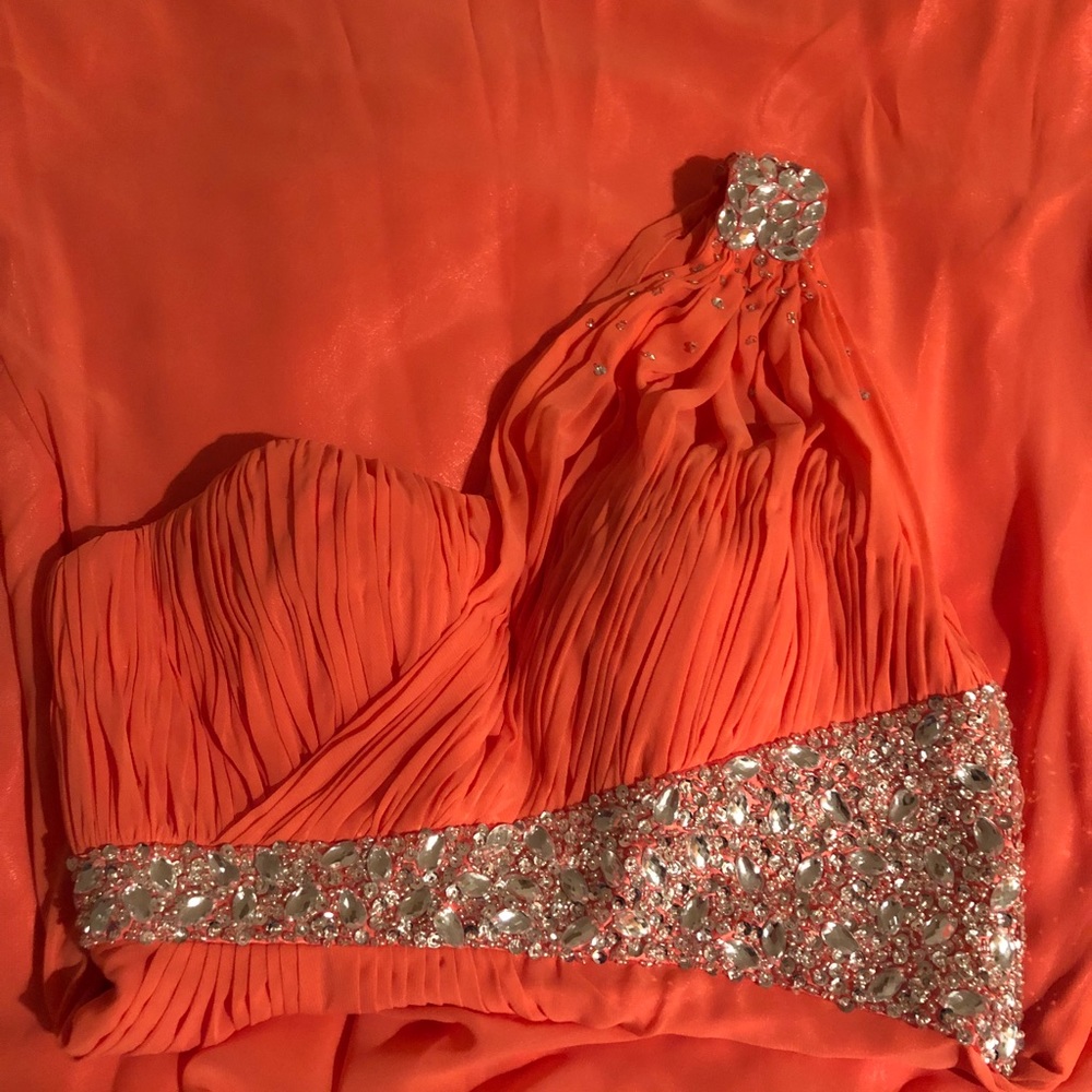 Long flowy coral prom dress.